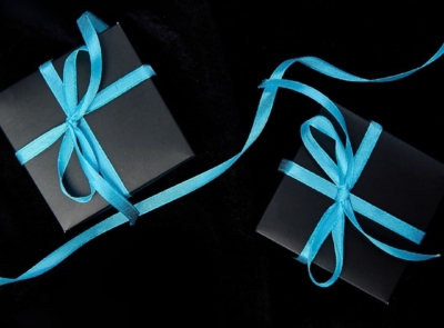 A scenic coastal view with a luxury hotel near the water's edge, lush green landscape, and a clear blue sky in the background. Perfect for a serene getaway.