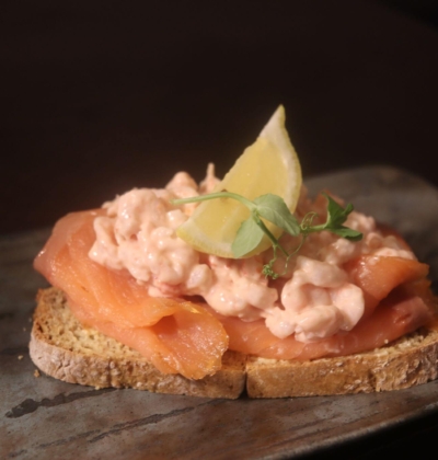Open-sandwich on sourdough bread topped with smoked salmon prawns and Marie Rose sauce