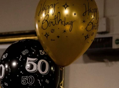 Gold and black balloons for 50th birthday celebrations