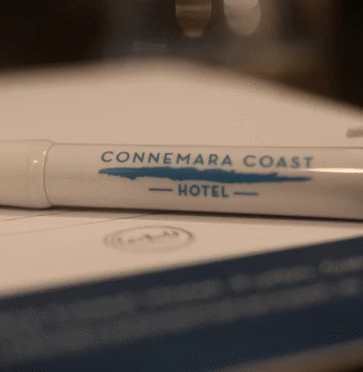 Black pen with "Connemara Coast Hotel" in gold lettering, against a white background.